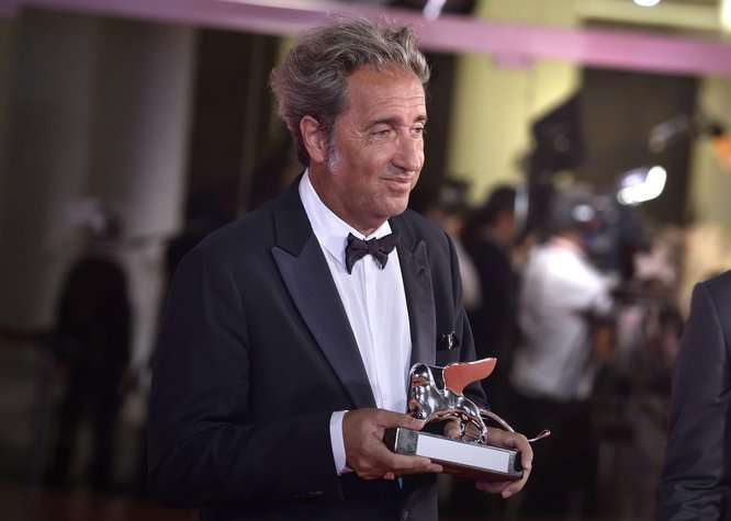 Venice, Italy. 11th Sep, 2021. Director Paolo Sorrentino and Filippo Scotti pose with the Silver Lion Grand Jury Prize and the Marcello Mastroianni Award for Best New Young Actor for "The Hand Of God" at the awards winner photocall during the 78th Venice